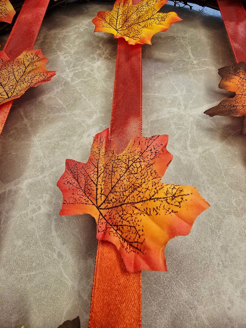 Warmth of Autumn Wreath - mandarin ribbon and leaf detail