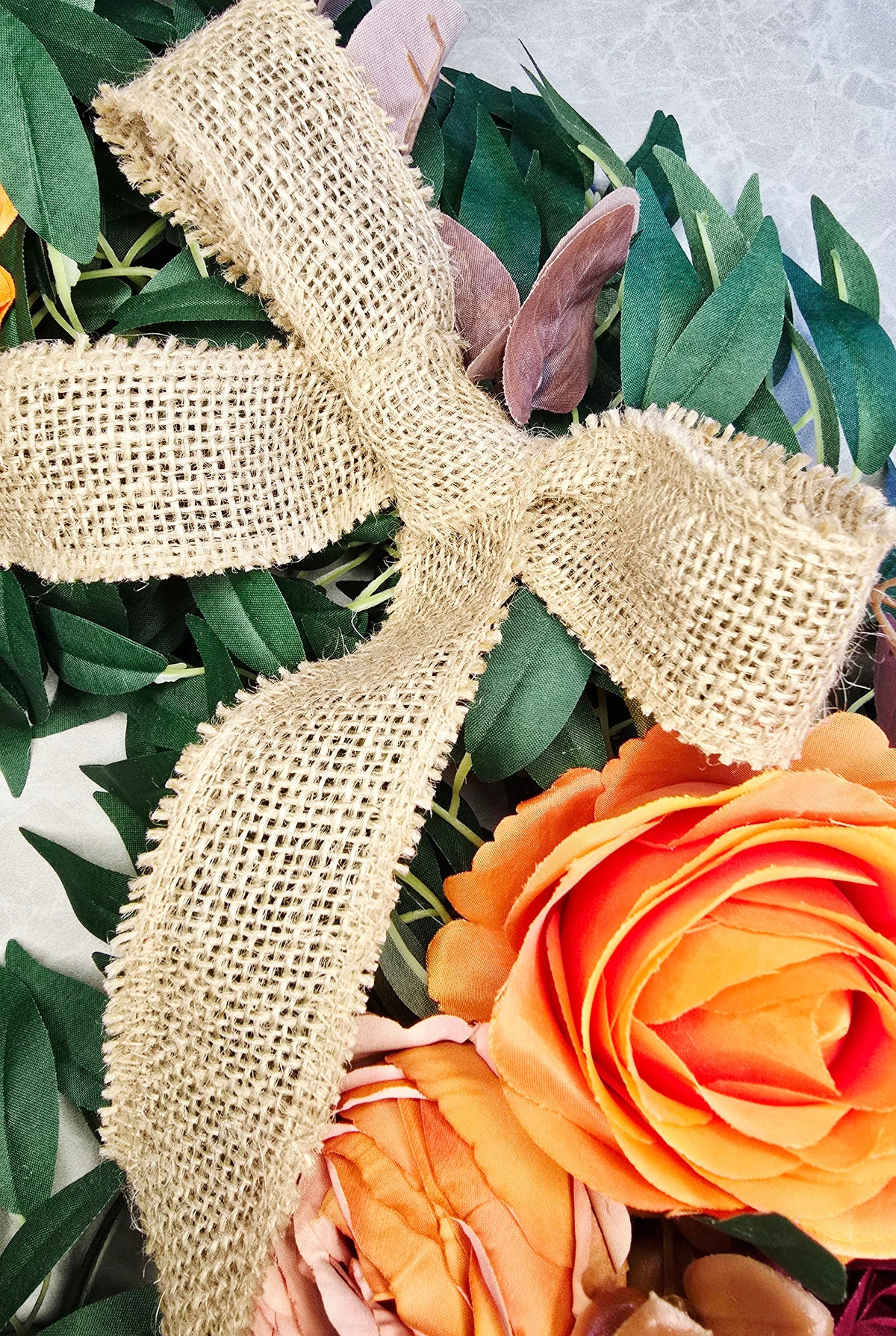 Amber & Mulberry Wreath - hessian bow and orange rose detail