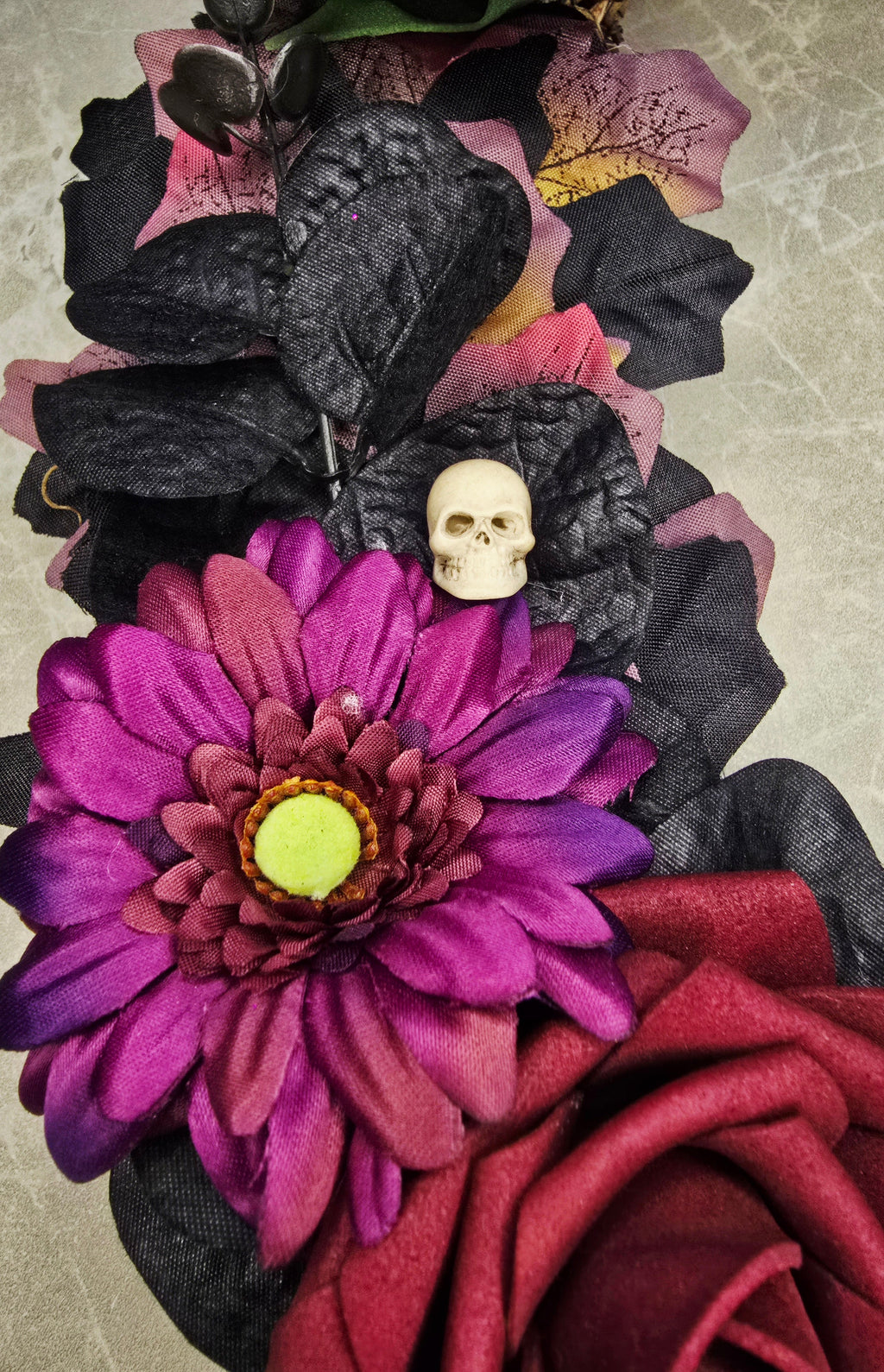 Spooky Sparkle Halloween Wreath - purple gerbera and mini skull detail